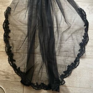 Black 36 in wedding veil. Single tier with lace.